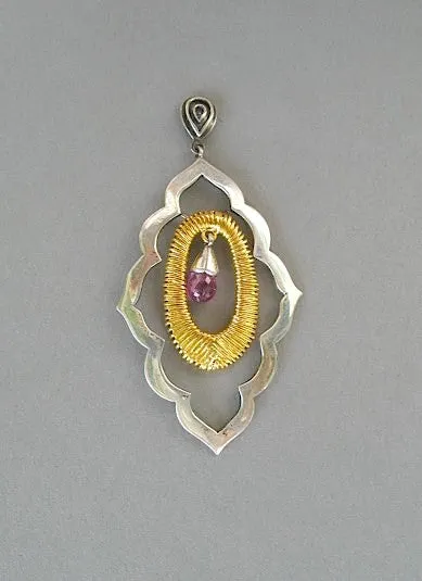 Beautiful, moroccan cut-out earrings with gold plated wire wrapping detail and a faceted garnet drop