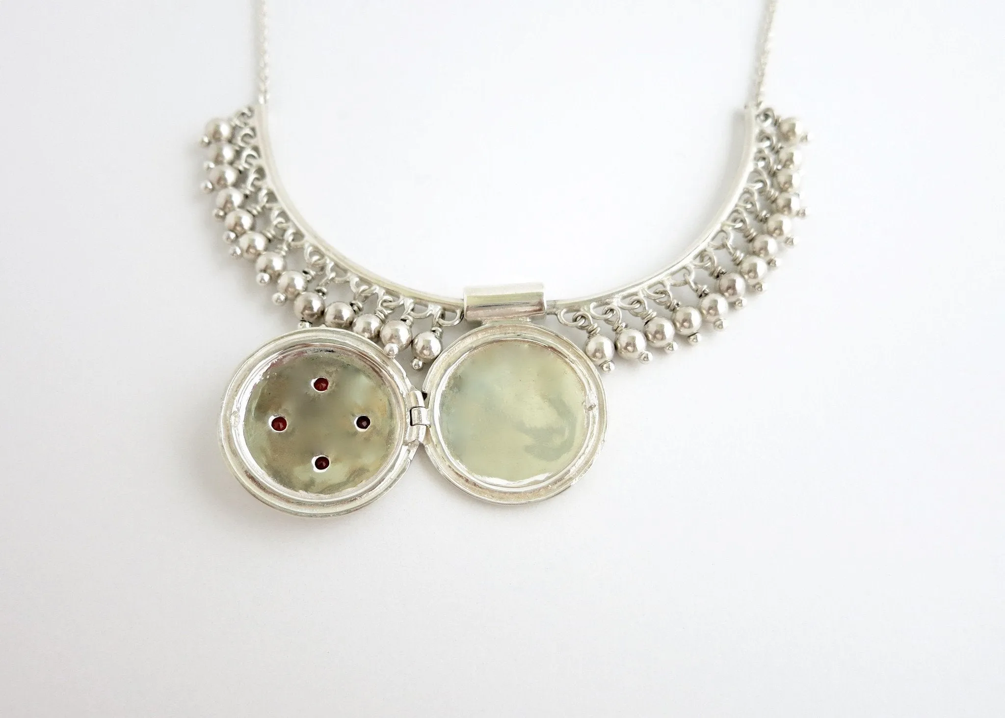 Vintage inspired, unique locket necklace in sterling silver and garnet